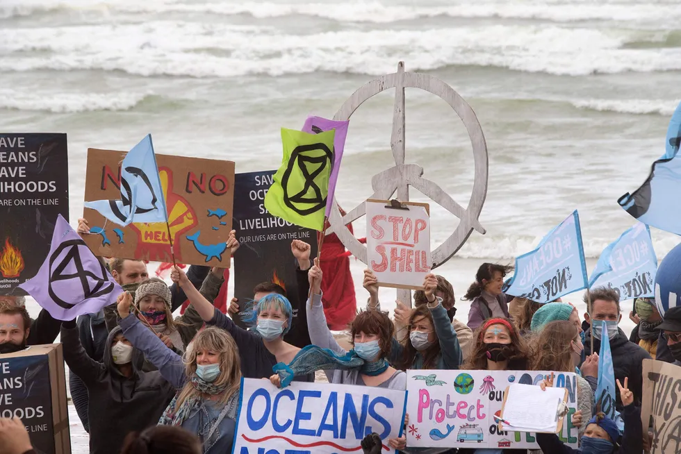 Up in arms: protesters against Shell’s seismic survey offshore the Wild Coast gathered at Muizenberg beach Cape Town - hundreds of kilometres from the survey location - on 5 December, prior to the interim indictment