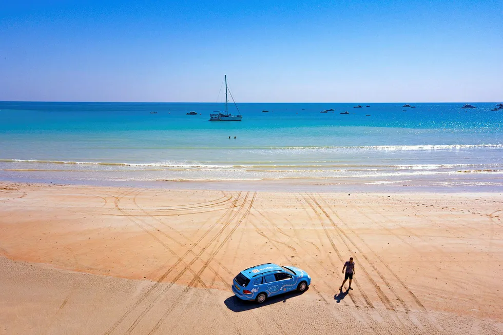 Development: an electric car on Cable Beach in Broome, Western Australia