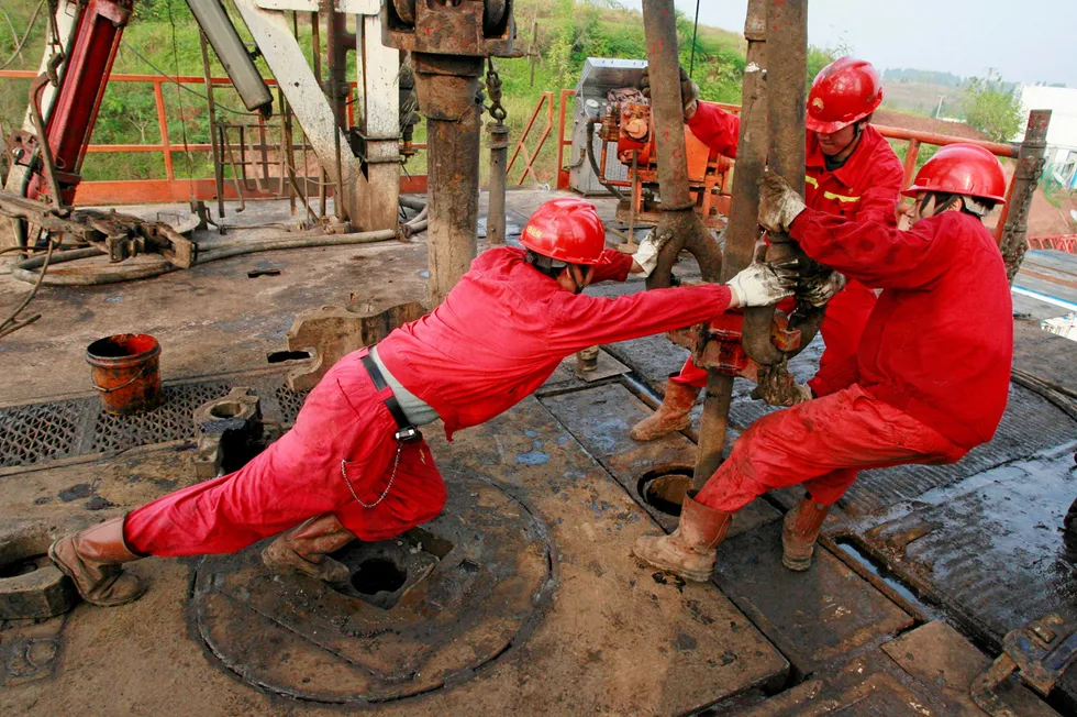 Effort: Workers in a PetroChina oilfield in the Sichuan basin