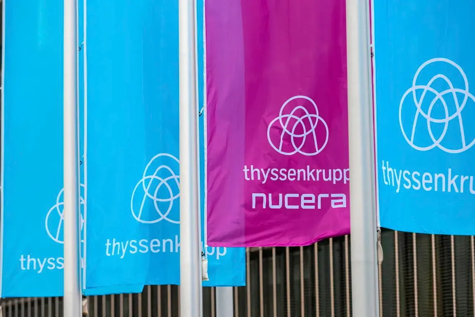 Thyssenkrupp and Thyssenkrupp Nucera flags outside company headquarters in Essen, Germany.