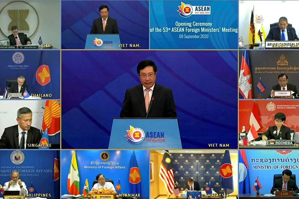 Screen time: Vietnamese Foreign Minister Pham Binh Minh delivers a speech in Hanoi during the opening of ASEAN Foreign Ministers' Meeting this week