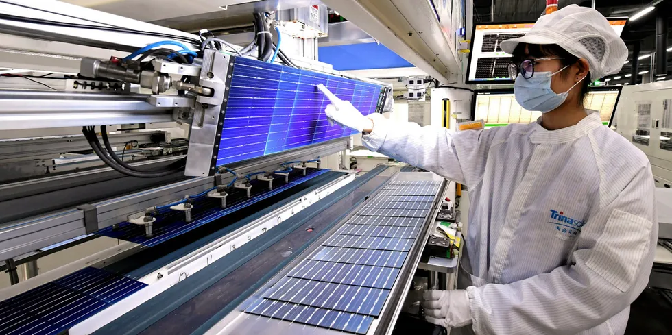 Production line of solar panels at a factory of Trina Solar in Yiwu, Zhejiang Province of China