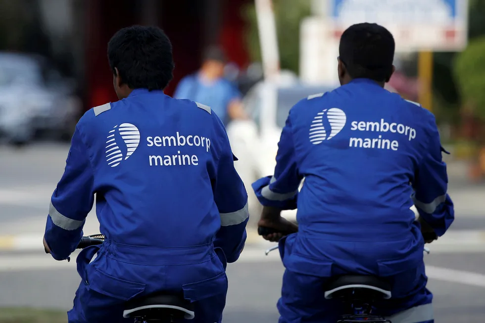Commuting: Sembcorp Marine workers cycle to the Admiralty Yard in Singapore