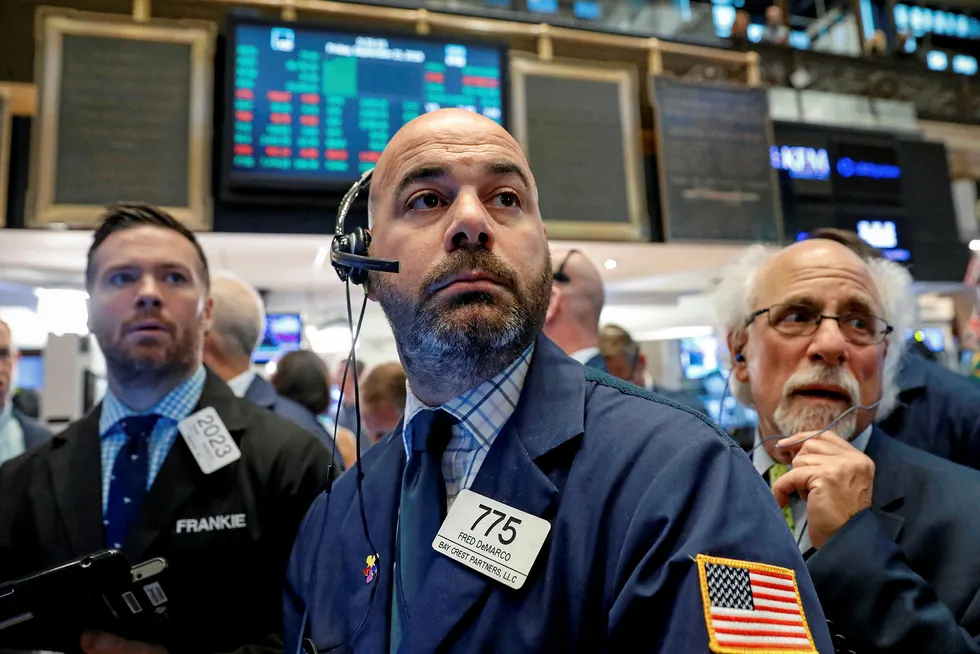 Traders work on the floor of the New York Stock Exchange (NYSE) in New York, U.S