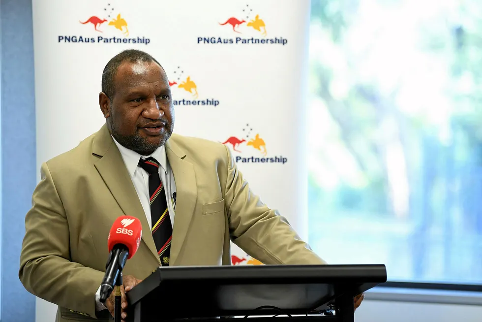 Papua New Guinea Prime Minister James Marape (C) speaks to staff, students and officials during a visit to the Cherrybrook Technology High School in Sydney on July 26, 2019. - Marape is on a six-day official visit to Australia. (Photo by JOEL CARRETT / POOL / AFP)