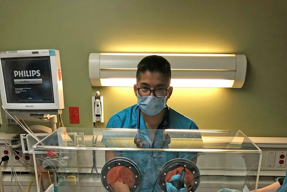 Safe entry: Houston physician Luis Chug demonstrates the ViraBox