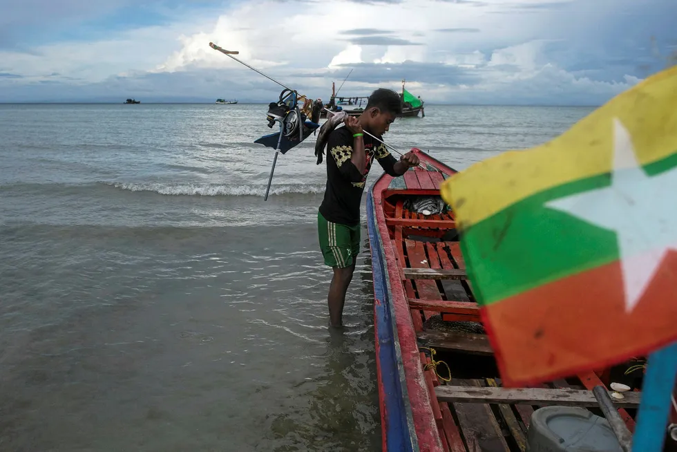 Offshore activity: a fisherman prepares his gear off the coast of southern Myanmar