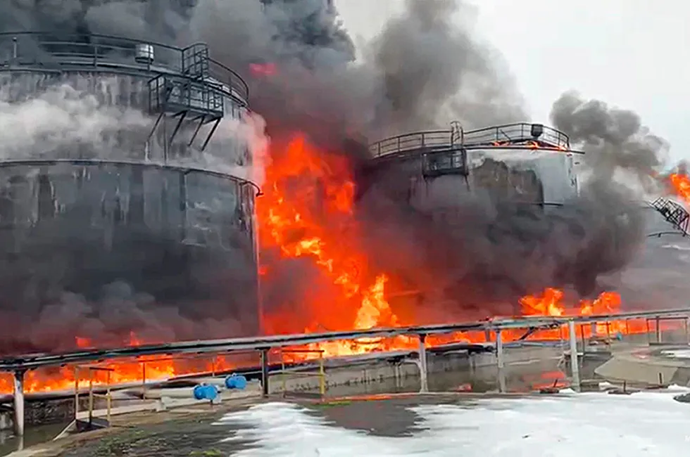 Destruction: Oil storage tanks ablaze near the city of Klintsy in the Bryansk region of Russia about 60 kilometers from the Russia-Ukrainian border, after an attack by an unidentified drone.