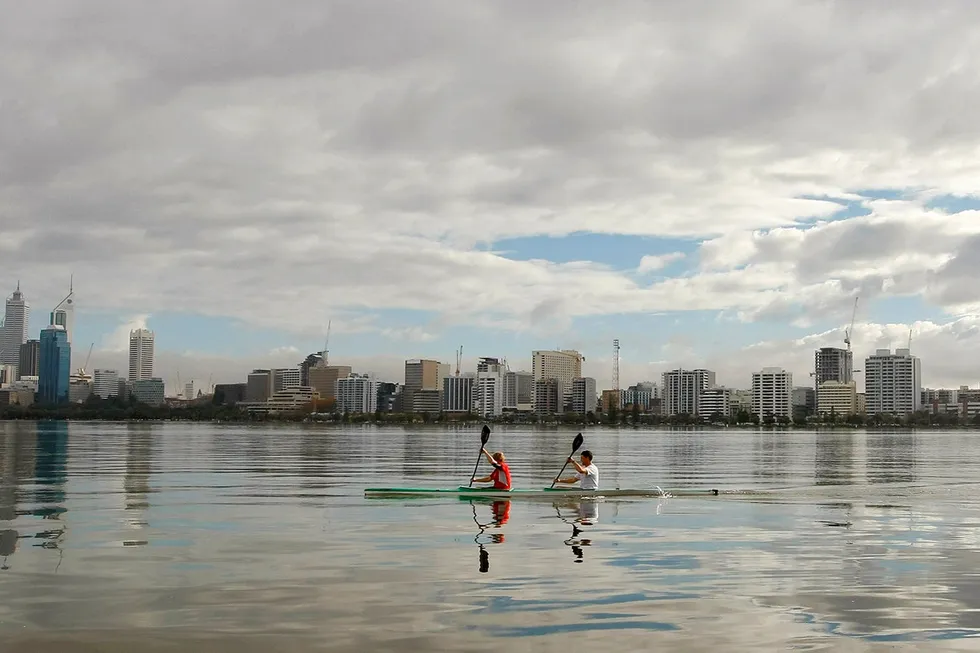 Progress: kayakers paddle on the Swan River in Perth, Western Australia