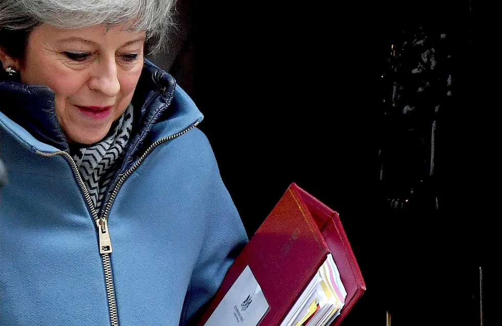 Britain's Prime Minister Theresa May leaves 10 Downing street in central London on March 6, 2019 ahead of Prime Minister's Questions (PMQs). - Europe's financial system faces "potential risks" to its stability arising from a no-deal Brexit, the Bank of England warned Tuesday, as it extended its weekly lending facilities to include euros. (Photo by Ben STANSALL / AFP) ---