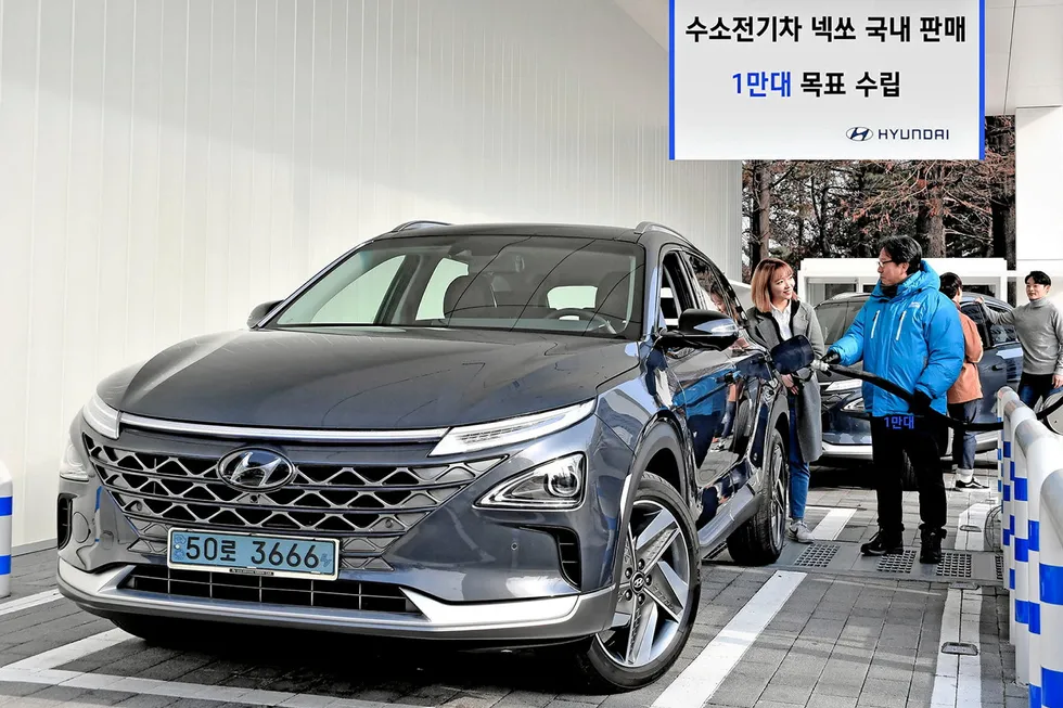 A Hyundai Nexo hydrogen fuel-cell car being refuelled at a South Korean filling station.