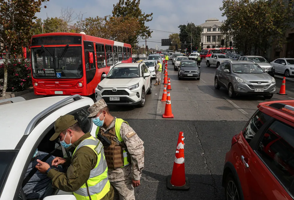 Lockdown: soldiers check commuters as authorities in Santiago, Chile announced the re-instatement of city-wide quarantine lockdown to help contain the spread of Covid-19