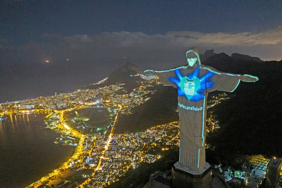 Lighting the way: Rio de Janeiro's iconic Christ the Redeemer statue is lit up as if wearing a protective mask amid the Covid-19 pandemic