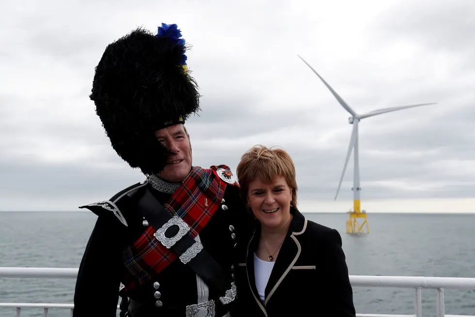 Wind power: Scotland's First Minister Nicola Sturgeon stands with piper Norman Fiddes at the inauguration of the European Offshore Wind Deployment Centre (EOWDC) off Aberdeen, Scotland, in 2018. Scotland's wind power ambitions have accelerated since then.