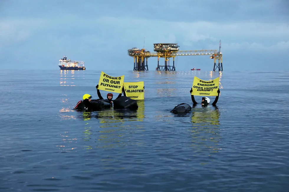 In the swim: Greenpeace activists en route to Dan Bravo platform
