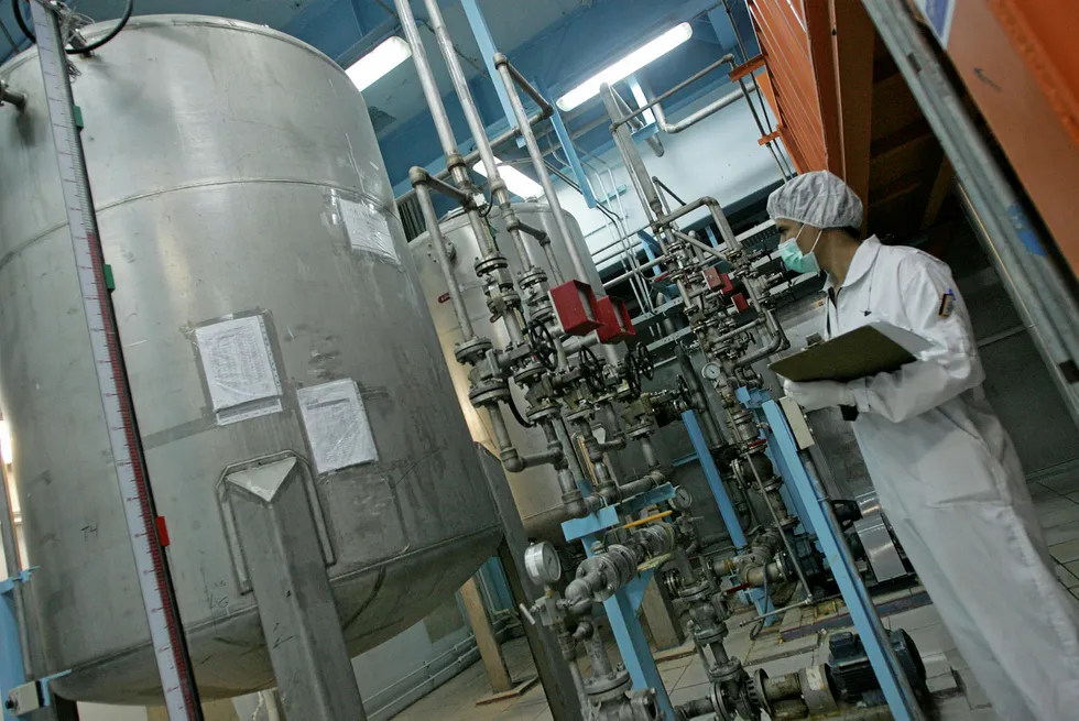 Controversy: An Iranian technician works at uranium conversion facilities