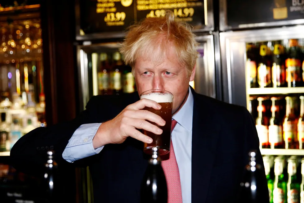 UK’s supply of food-grade CO2, a byproduct of ammonia production, is critical to sectors from beer and soft drinks to food packaging and meat. Boris Johnson, the U.K. Prime Minister, drinks beer from a pint glass during a campaign tour, in London in 2019.