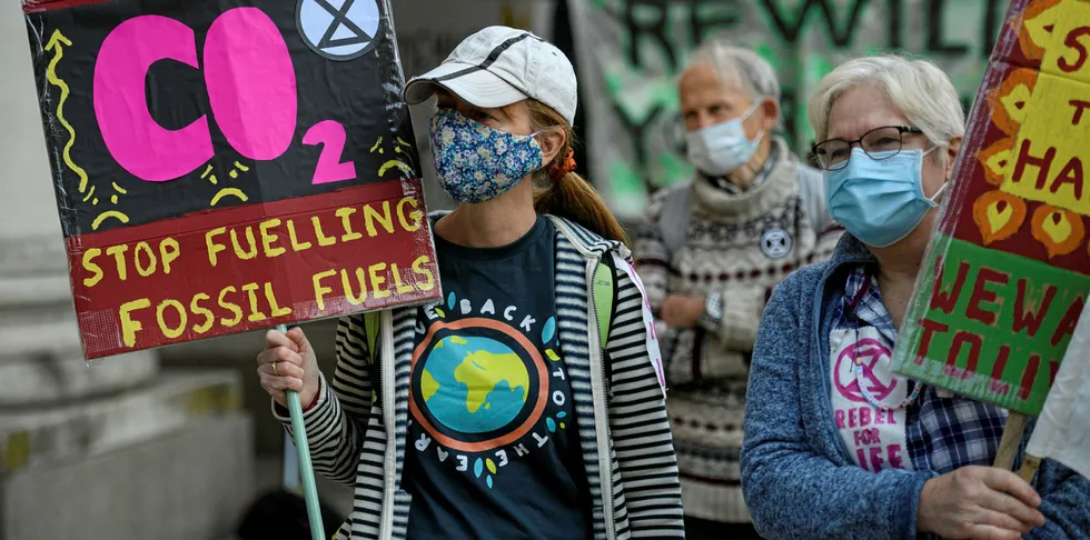 Activists from the climate protest group Extinction Rebellion stage a demonstration in St. Peter's Square, Manchester, northern England.