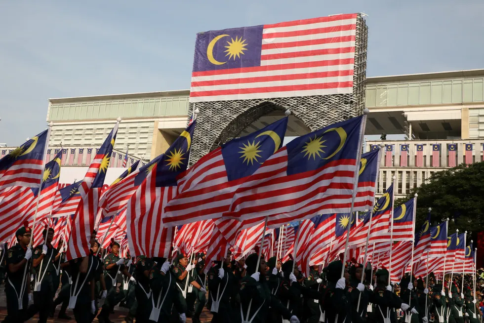 Patriotic: flag bearers march past during Merdeka Day (Independence Day) celebrations in Putrajaya, Malaysia