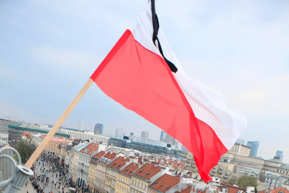 Billowing: the flag of Poland is blown by the wind in Warsaw