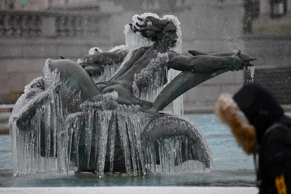Frozen: a mermaid statue in one of the fountains in London's Trafalgar Square during a spell of extreme cold in February