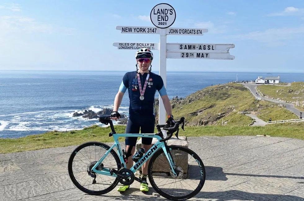 End of journey: Greg McAllister at Land's End in Cornwall in England after his marathon effort