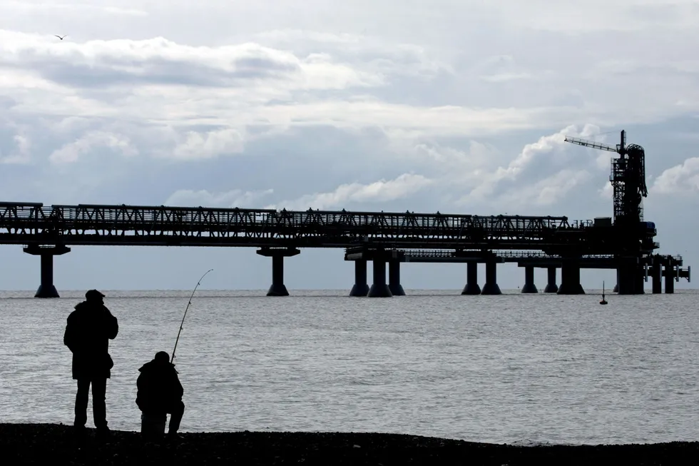 Declining catch: Men fish in the sea near the Sakhalin 2 LNG plant loading jetty in the town of Prigorodnoye in the south of Sakhalin Island in Russia’s far east.
