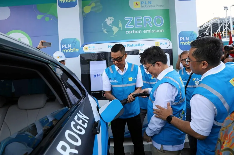 Darmawan Prasodjo and colleagues filling a Toyota Mirai at the new pilot refuelling station in Jakarta.
