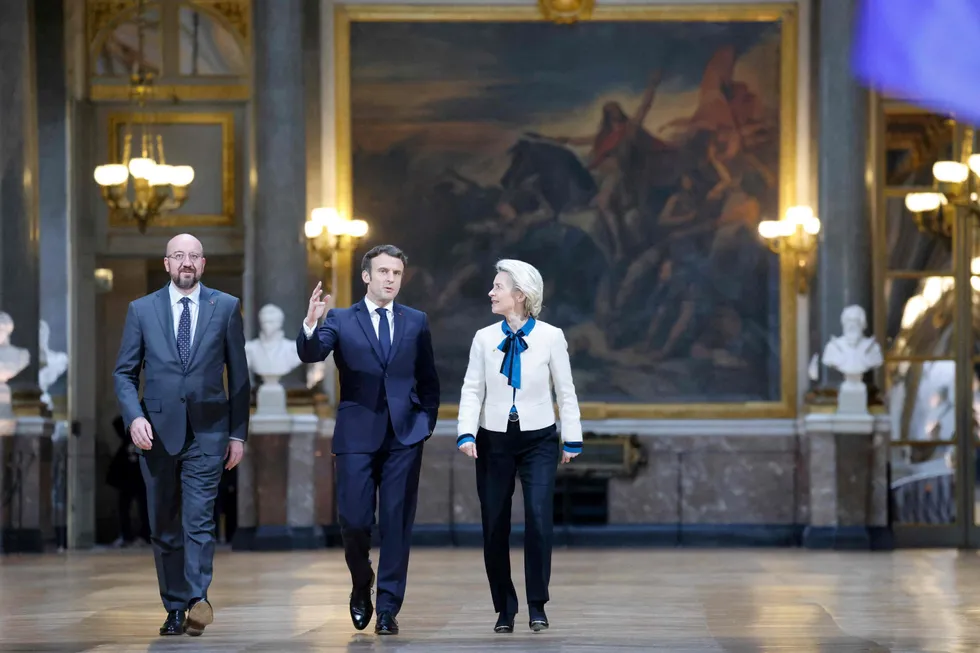 (L-R) European Council president Charles Michel, French president Emmanuel Macron and European Commission president Ursula von der Leyen arrive to hold a press conference following an EU leaders summit.