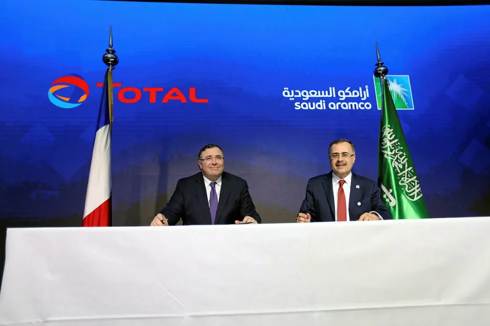 Petrochems MoU: Patrick Pouyanne, chief executive of Total, with Amin Nasser, chief executive of Saudi Aramco