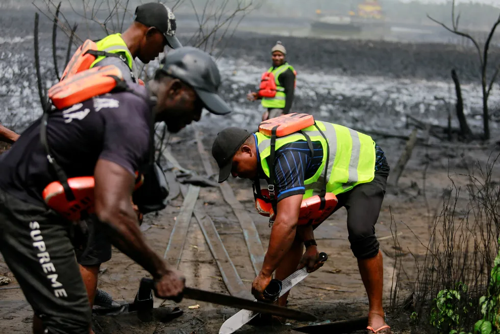 Abuja's number one priority: members of Nigeria's task force on oil theft and artisanal refining destroy an illegal camp in Okrika, Rivers State in January 2022