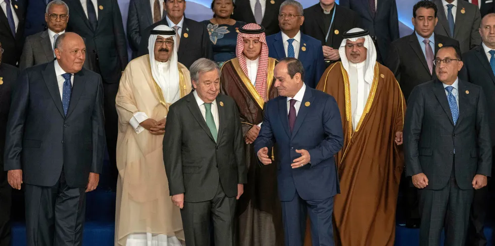 Egyptian President Abdel Fattah El-Sisi, center right, and United Nations Secretary-General Antonio Guterres, center left, leave after a group photo at the COP27 Climate Summit, in Sharm el-Sheikh, Egypt.