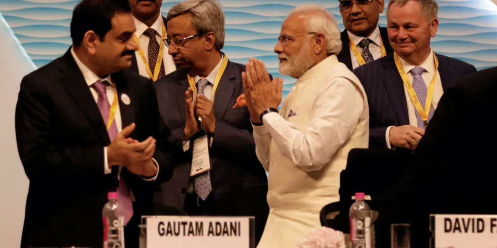 Prime Minister Narendra Modi with Gautam Adani, chairman and founder of the Adani Group (left).