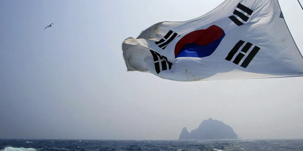 A South Korean flag flies from a South Korean coast guard ship.