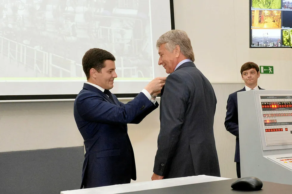 Better days: Yamal-Nenets Regional Governor Dmitry Artyukhov (left) decorates Novatek chairman Leonid Mikhelson after the gas producer started a second train at Yamal LNG in Russia
