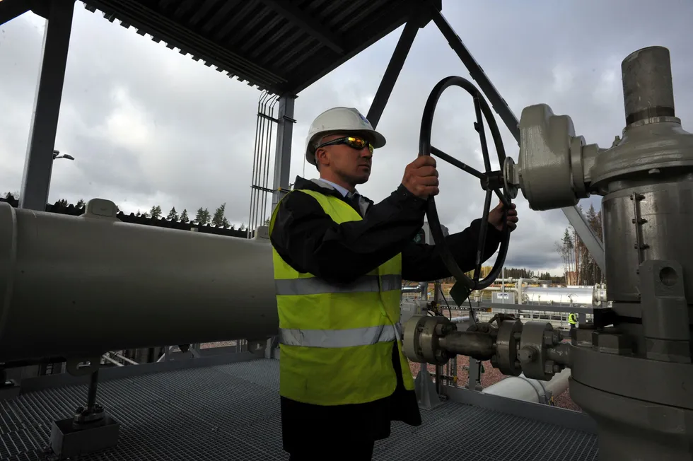 Shifting the balance: an operator feeding natural gas into the offshore segment of the Nord Stream pipeline at the Portovaya compression station, Vybog, north-western Russia,