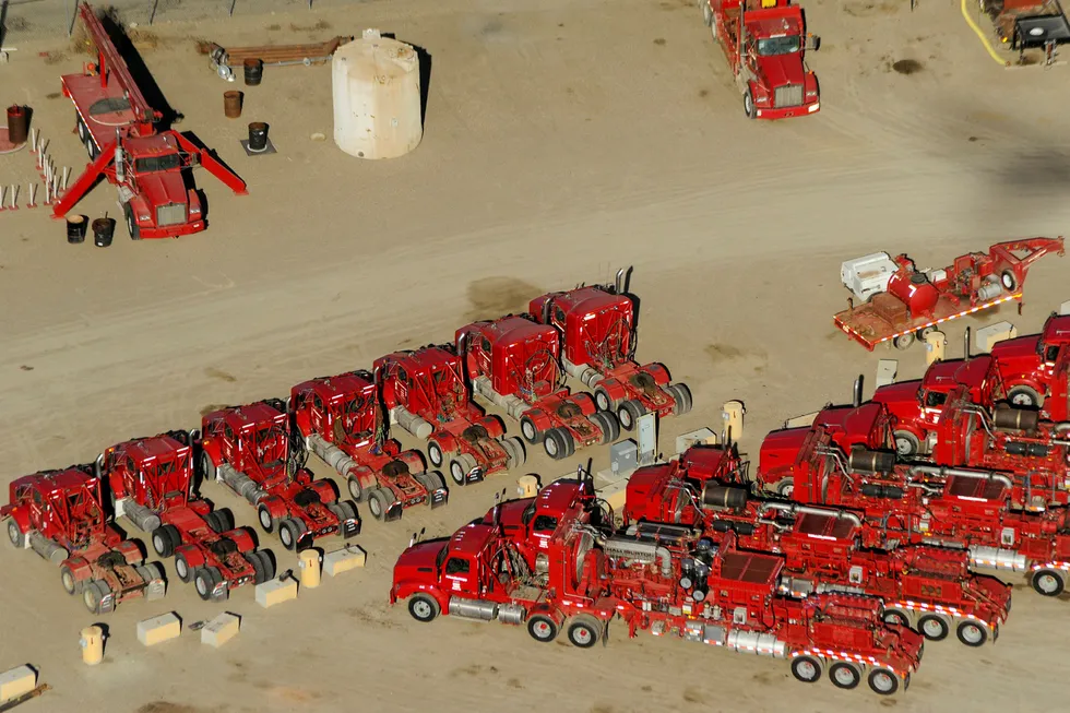 Shale patch pain: idle trucks and oil production equipment are seen in a Halliburton yard in Williston, North Dakota in 2016