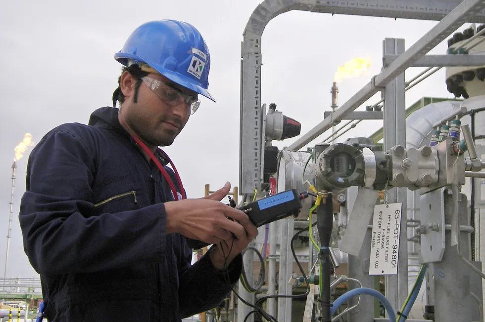 Challenges: A worker reads data at an oil and gas processing plant at the Tengiz oilfield in Kazakhstan.
