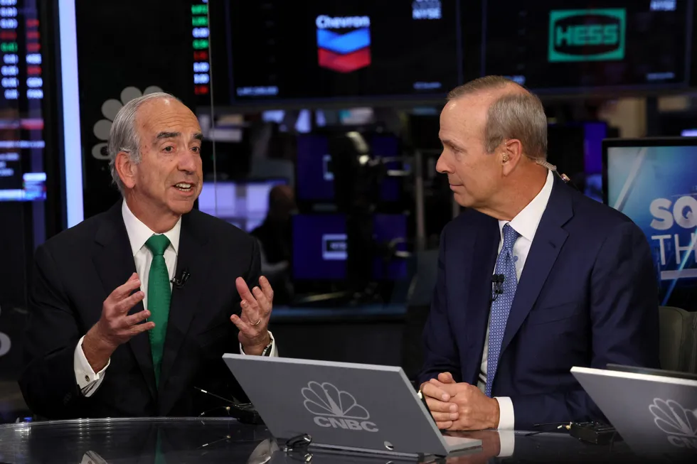 Chevron chief executive Mike Wirth, right, and Hess chief executive John Hess appear on CNBC to speak about Chevron’s deal to buy Hess for $53 billion on the floor of the New York Stock Exchange last October.