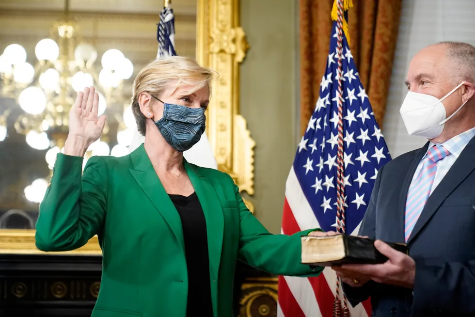 Gone green: former Michigan governor Jennifer Granholm is sworn in as Energy Secretary as her husband Dan Mulhern looks on