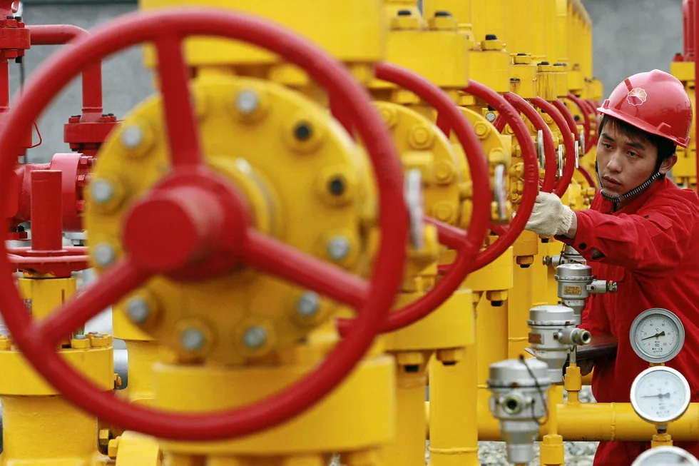 Linking up: a worker checks the pipelines at a oilfield in Sichuan province