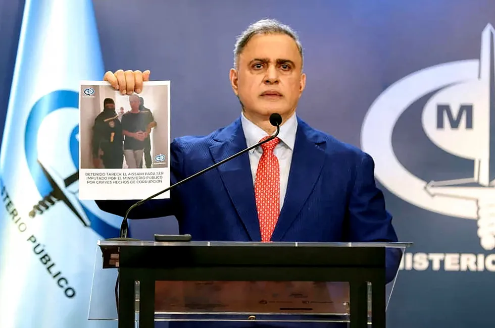 Handcuffed: Venezuela’s Attorney General Tarek William Saab holding a picture showing the arrest of former Oil Minister Tareck El Aissami