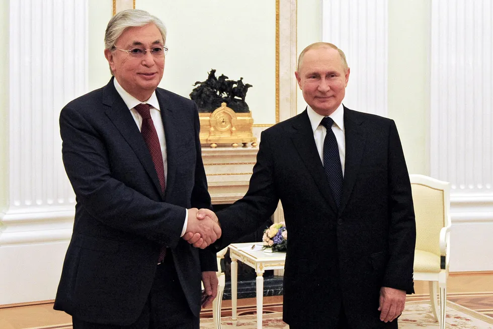 New mentor: Kazakhstan's President Kasym-Zhomart Tokayev (left) shake hands with Russian President Vladimir Putin