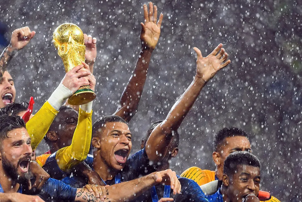 Winners: France's players lift the World Cup trophy after beating Croatia in the final in Moscow