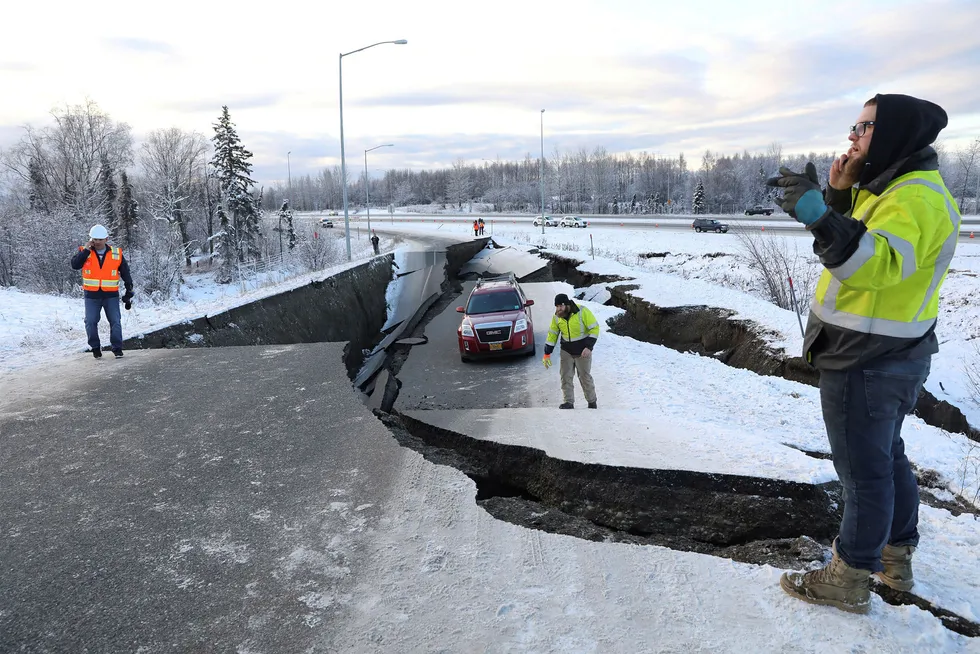 Earthquake: a stranded vehicle lies on a collapsed roadway near the airport