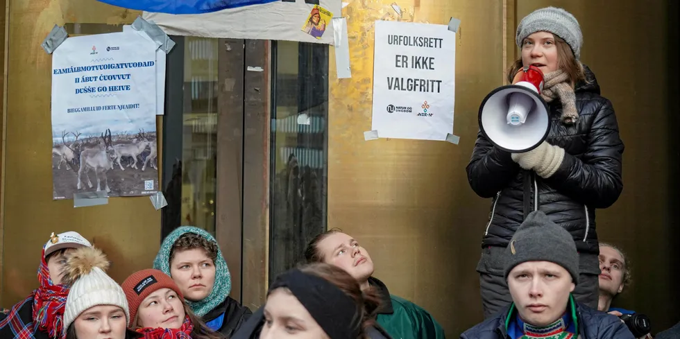 Greta Thunberg and other young climate activists block the entrance of Norway's Energy Ministry.