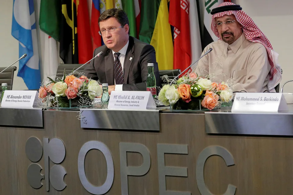 Teaming up: Russian Energy Minister Alexander Novak (left) and Saudi Arabia Oil Minister Khalid al Falih (right) after the latest Opec meeting in Vienna