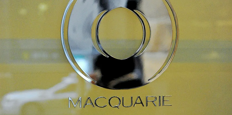A street scene is reflected in the logo of Macquarie Bank as Australia's biggest investment bank announces a full-year net profit of 1.04 billion USD in Sydney on April 29, 2011. Macquarie Group Ltd's net profit, down nine percent on the previous financial year, was broadly in line with expectations given subdued equity market conditions. AFP PHOTO / Torsten BLACKWOOD (Photo credit should read TORSTEN BLACKWOOD/AFP/Getty Images) Macquarie GIB. Macquarie logo.