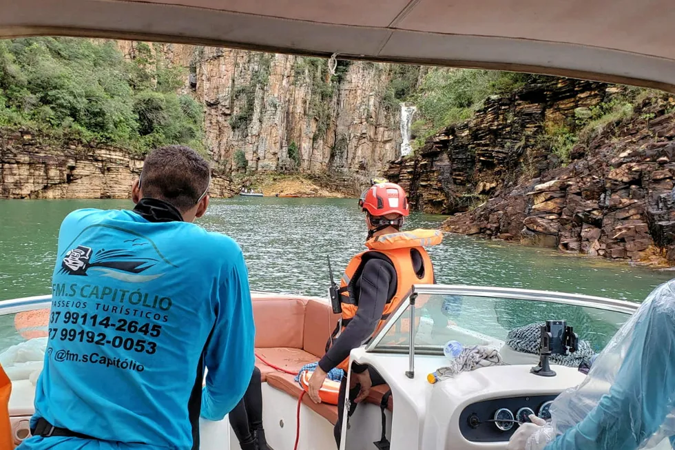 Aftermath: rescuers search for victims after a wall of rock collapsed on top of motorboats below a waterfall in Brazil’s Minas Gerais state earlier this month