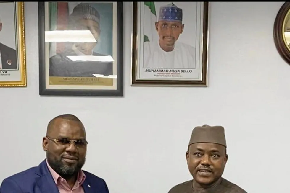 Key certificate: UTM Offshore chief executive and managing director Julius Rone (left) receives an FLNG licence from Sarki Auwalu, chief executive of Nigeria's Department of Petroleum Resources, in March 2021